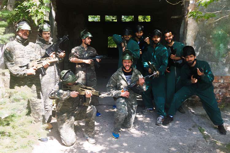 A friendly team building airsoft or paintball battle